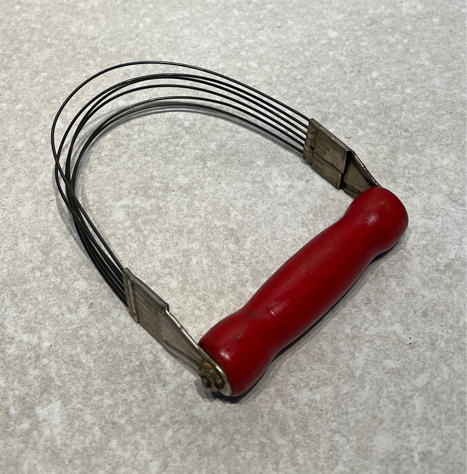 Red Handled Decorative Utensil