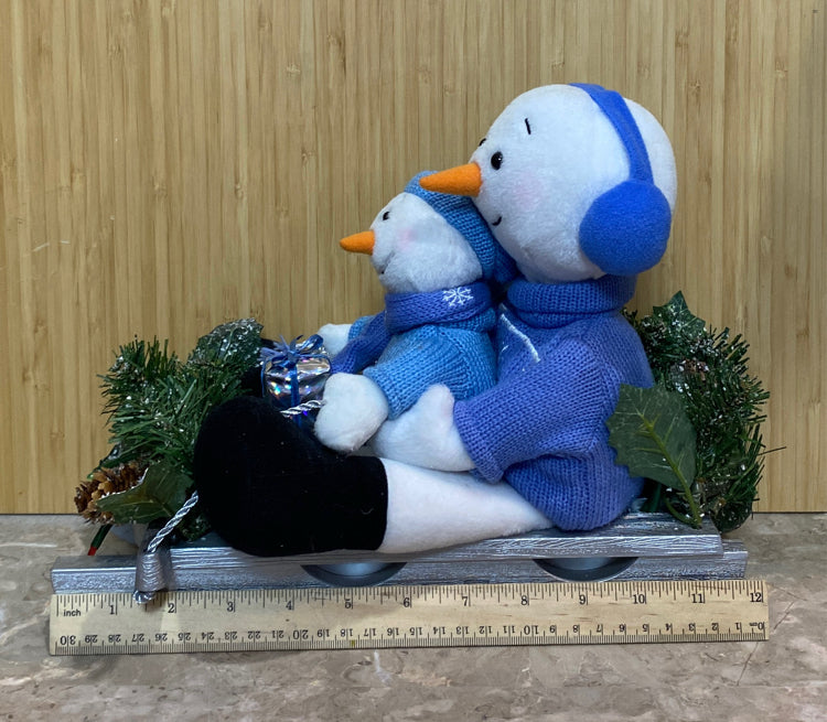 Snowman On Sled