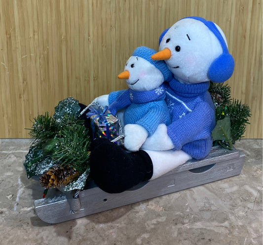 Snowman On Sled