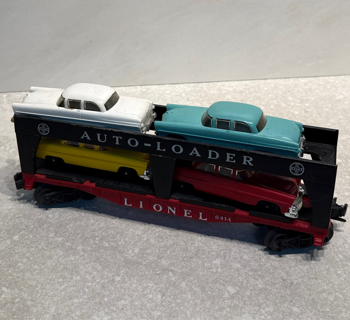 Lionel 6414 Flatcar with 4 Cars